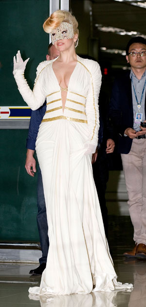 Lady Gaga does airport-chic in couture gown