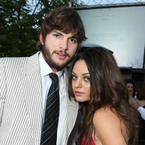 Mila and Ashton relax on Hampstead Heath