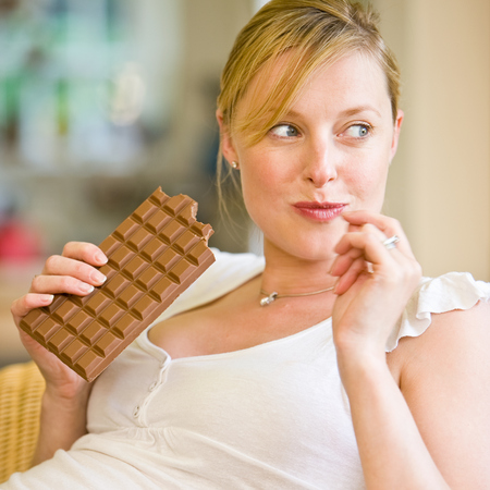 Pregnant Woman Eating Chocolate
