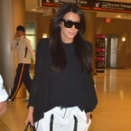 Pregnant Kim Kardashian does Helmut Lang comfort for flight