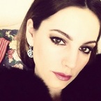 Kelly Brook slicks on pink lippy for a sultry look