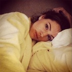 Kelly Brook does a Victoria Beckham in fresh white robe
