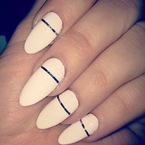 Khloe Kardashian does metallic stripe nails with white polish