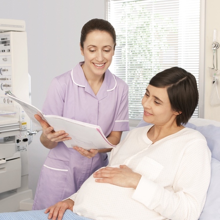Pregnant woman with midwife