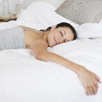 Woman sleeping happy in bed