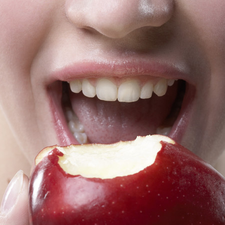 Woman eating an apple