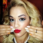 Rita Ora shows off bright and bold stage makeup
