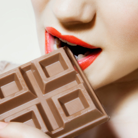 Woman eating chocolate