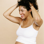 Pregnant woman in white vest