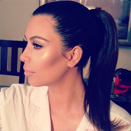 Kim Kardashian shows off sleek high ponytail