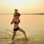Mother and baby on the beach