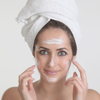 Woman applying face cream