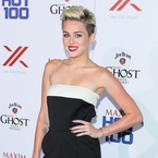Miley Cyrus styles sexy Valentino jumpsuit at Maxim Hot 100 party