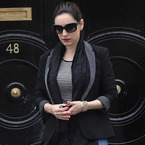 Kelly Brook does the big black boot thing