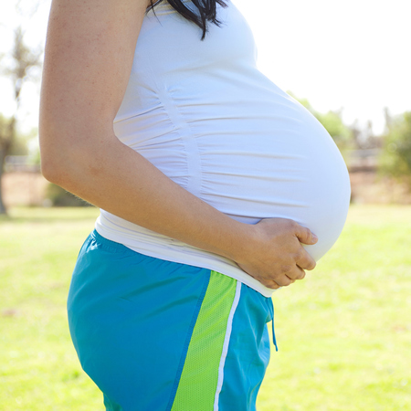 Pregnant woman in exercise clothes