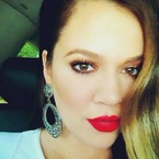 Khloe Kardashian shows off perfect red pout