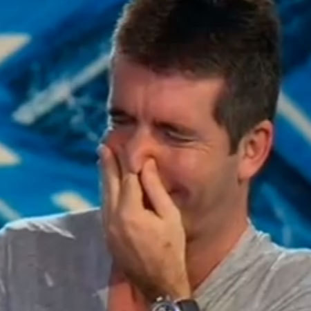Simon Cowell laughing