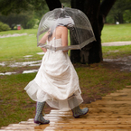 A bride caught in the rain - weddings- handbag.com