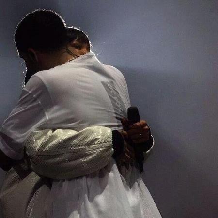 Rihanna and drake - couple - dating - paris concert perform - hugging - handbag.com