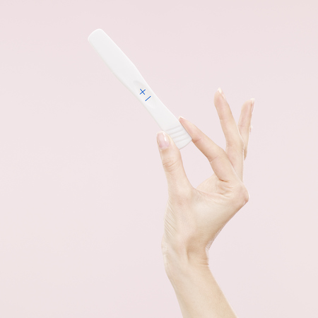 positive pregancy test - study - wine and stress affects conception - baby bag - handbag.com