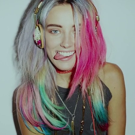 Skullcandy headphones designed just for women - model wearing skull candy headphones - day bag - handbag