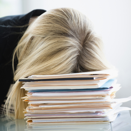 woman falling asleep at desk - study shows workers fall asleep at desks - 6 ways to get more energy - gym bag - handbag.com