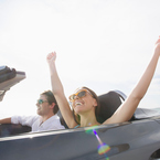couple in sports car - living the the highlife can make you sad - news - day bag - handbag.com