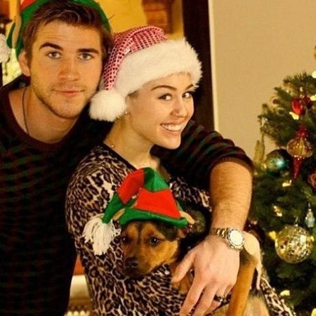 Miley Cyrus's Christmas Card - Bare Breasts and Fat Tongue: Looks Like A Cheap Adult Film Poster (Photos)